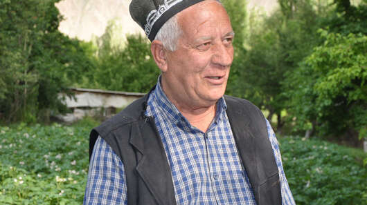 Azim Choragabov (65) in his garden in Pokhut village, Zerafshan valley, Northern Tajikistan.
