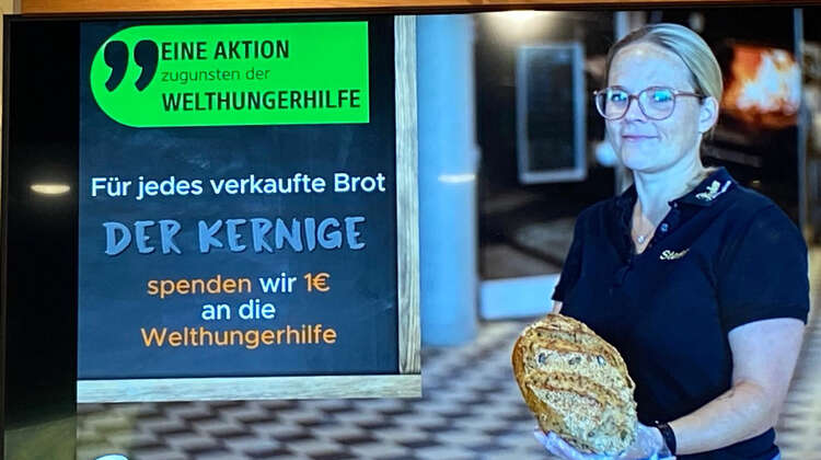 Foto von einer Bäckerei-Werbung auf einem Bildschirm, die das Charity-Solibrot bewirbt
